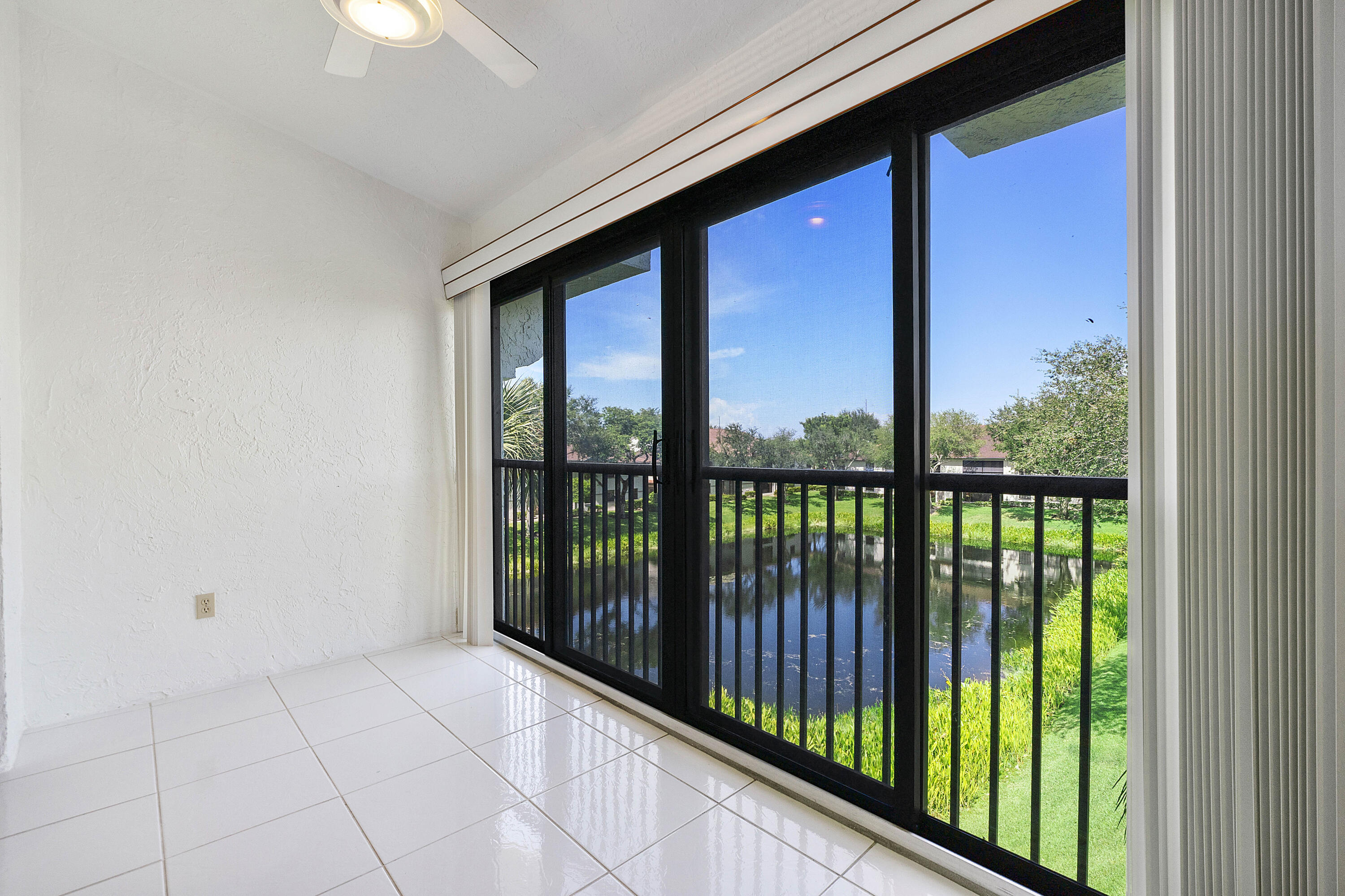 5153 Floria Drive, Unit V Boynton Beach, FL 33437 - Photo 23 of 39 a view of a glass door with a balcony