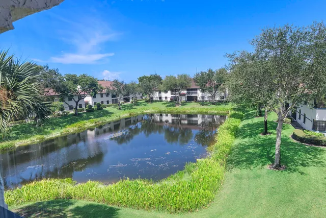 a view of a lake with a yard