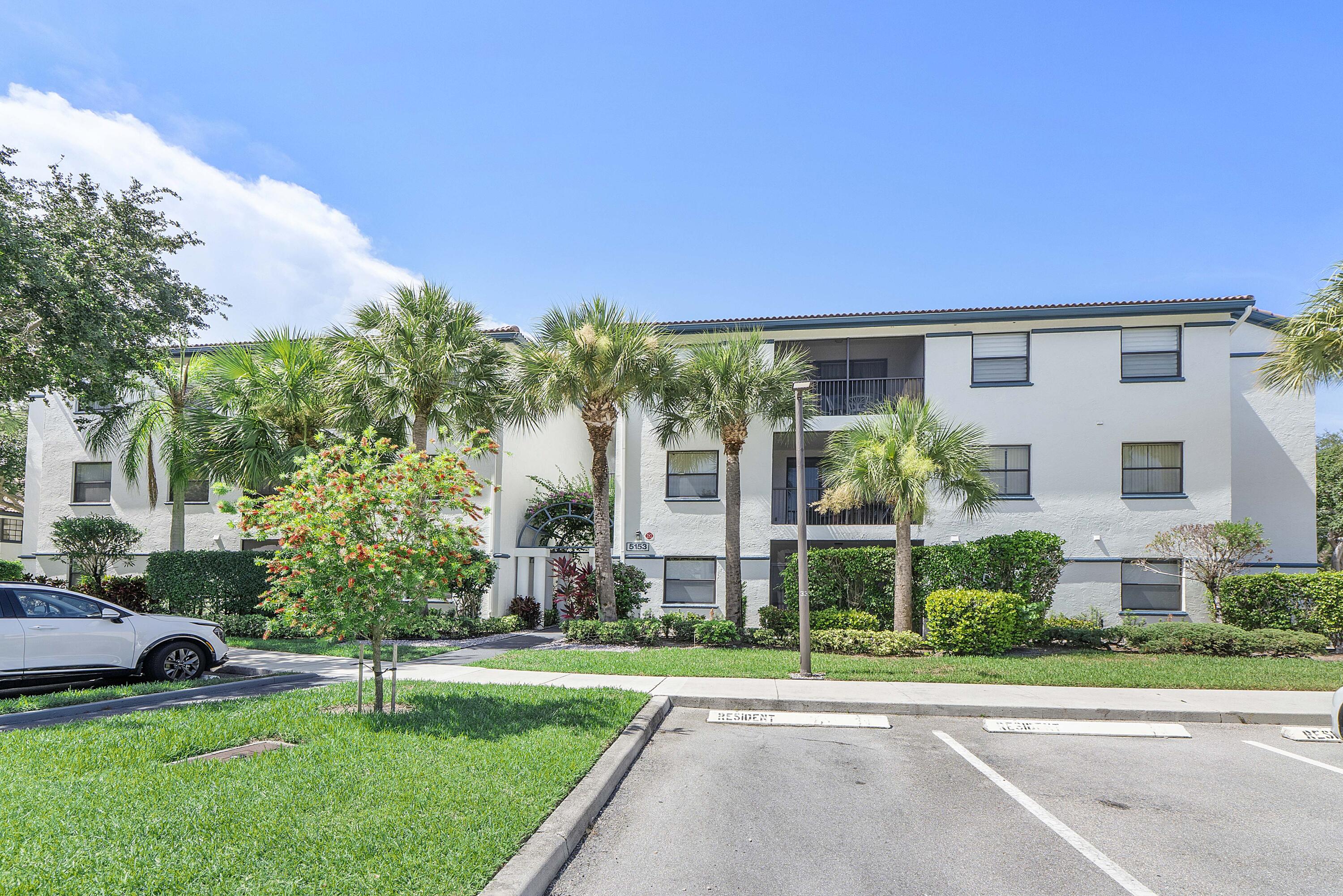 5153 Floria Drive, Unit V Boynton Beach, FL 33437 - Photo 26 of 39 a view of a house with a yard
