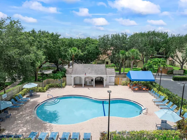 an aerial view of a house with outdoor space