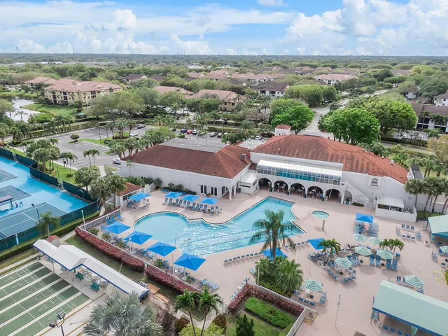 an aerial view of residential houses with outdoor space and river