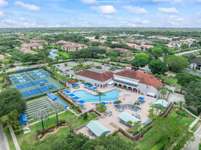 an aerial view of residential houses with outdoor space and street view