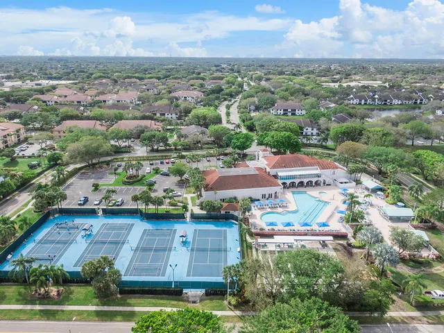 an aerial view of residential houses with outdoor space and river