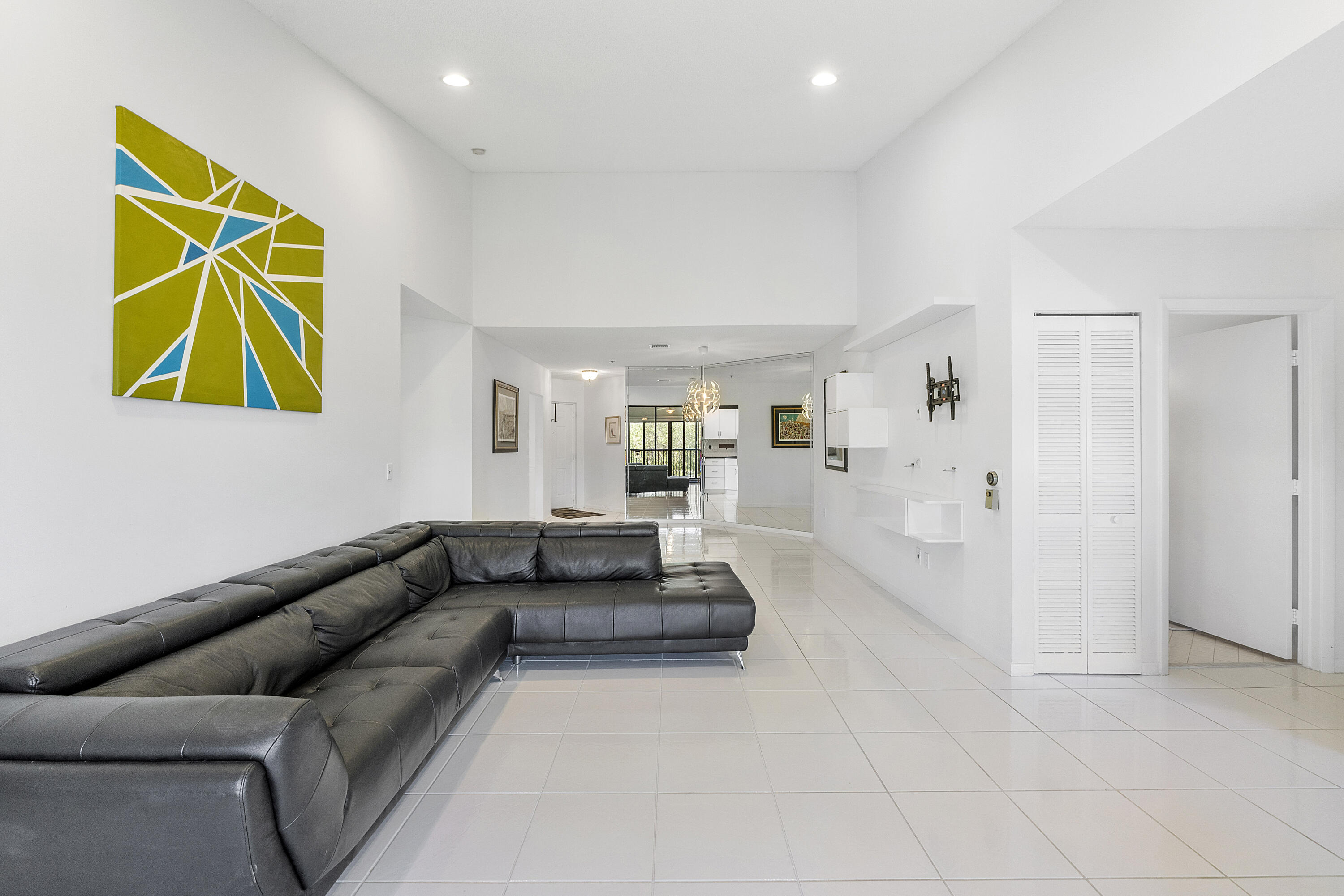 5153 Floria Drive, Unit V Boynton Beach, FL 33437 - Photo 7 of 39 a living room with furniture and kitchen