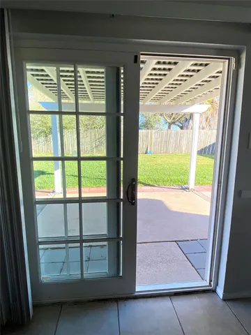 a view of porch with a small yard