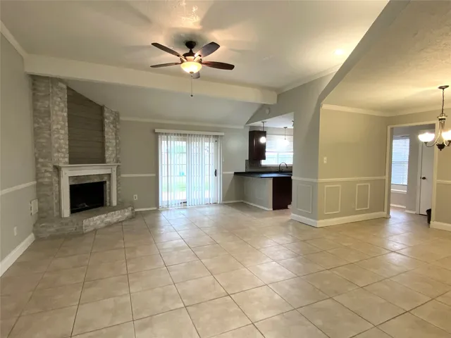a view of a kitchen with a sink and a fireplace
