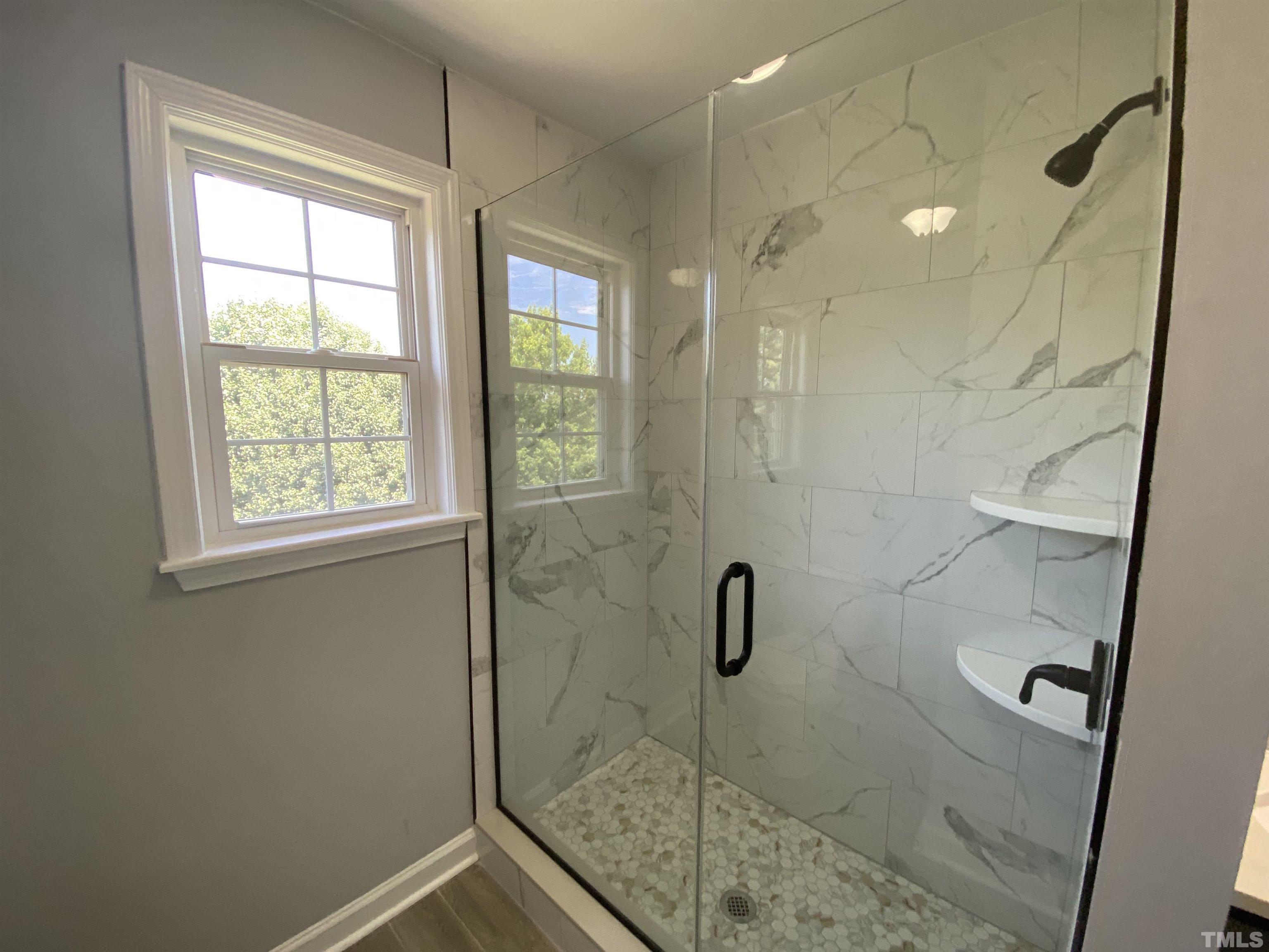 4815 Elmhurst Ridge Court Raleigh, NC 27616 - Photo 17 of 25 a bathroom with a shower