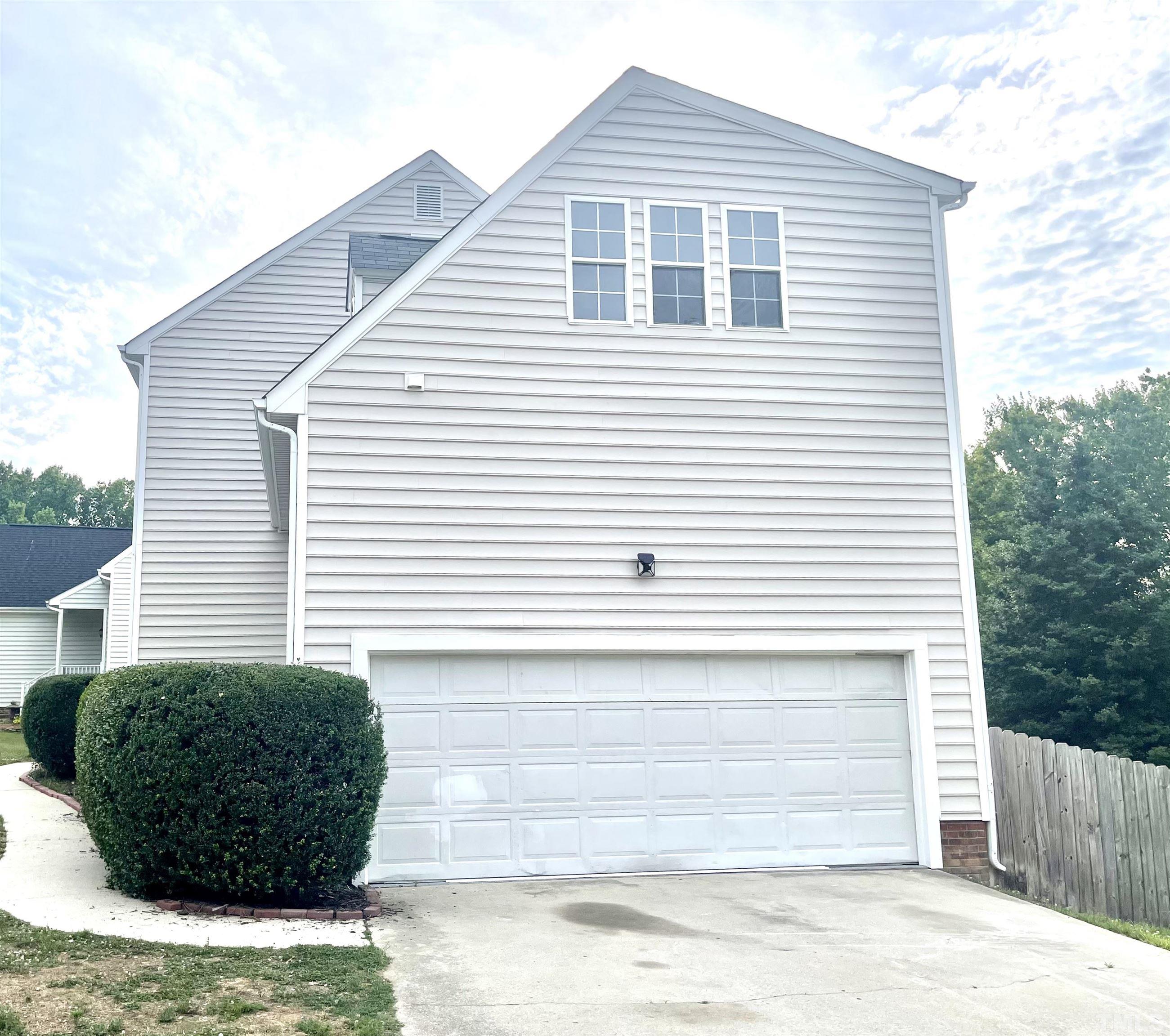 4815 Elmhurst Ridge Court Raleigh, NC 27616 - Photo 3 of 25 a view of a house with a yard