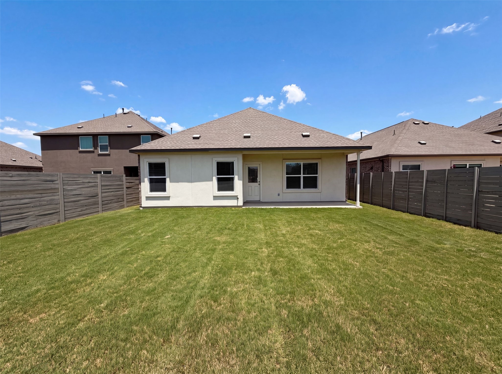 424 Wolf Springs Road Georgetown, TX 78628 - Photo 5 of 15 A private yard with a fresh lawn offers a serene outdoor retreat for relaxation and entertainment.