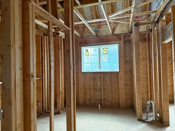 a view of a hallway with wooden walls