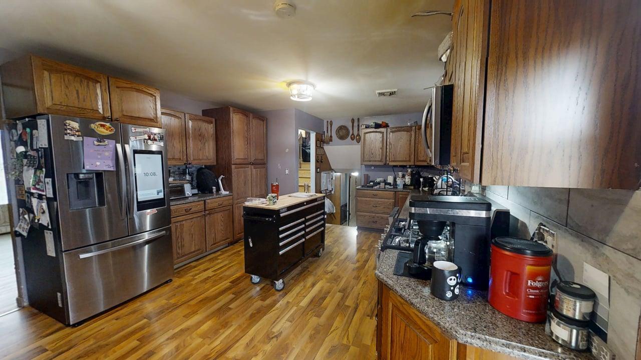 2308 Slayback Street Urbana, IL 61802 - Photo 11 of 37 a kitchen with stainless steel appliances a refrigerator and a stove top oven
