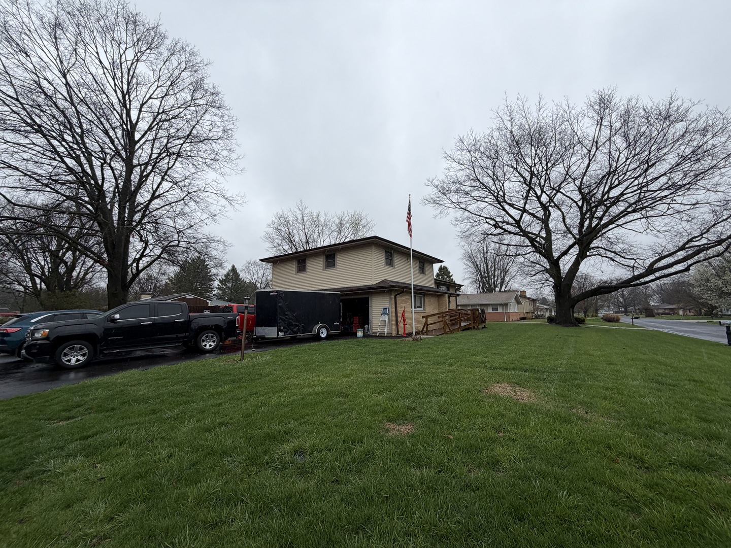 2308 Slayback Street Urbana, IL 61802 - Photo 2 of 37 a view of a house with a big yard and large trees