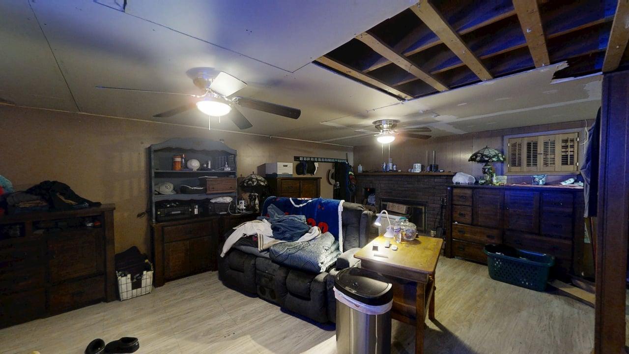 2308 Slayback Street Urbana, IL 61802 - Photo 22 of 37 a living room with lots of furniture and clutter