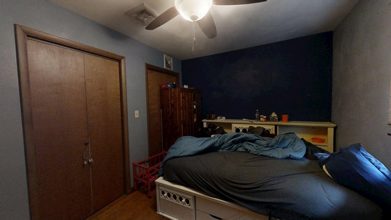 2308 Slayback Street Urbana, IL 61802 - Photo 27 of 37 a bed sitting in a bedroom next to a bathroom