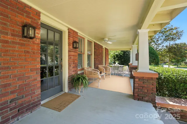 a backyard of a house with outdoor seating
