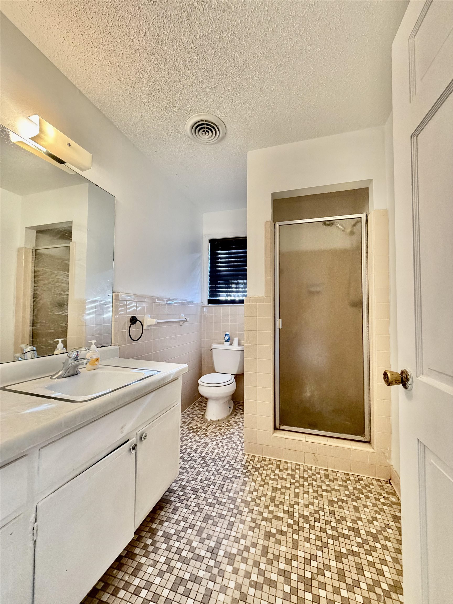 3179 Coleman Road Memphis, TN 38128 - Photo 15 of 22 a bathroom with a sink a toilet and a mirror