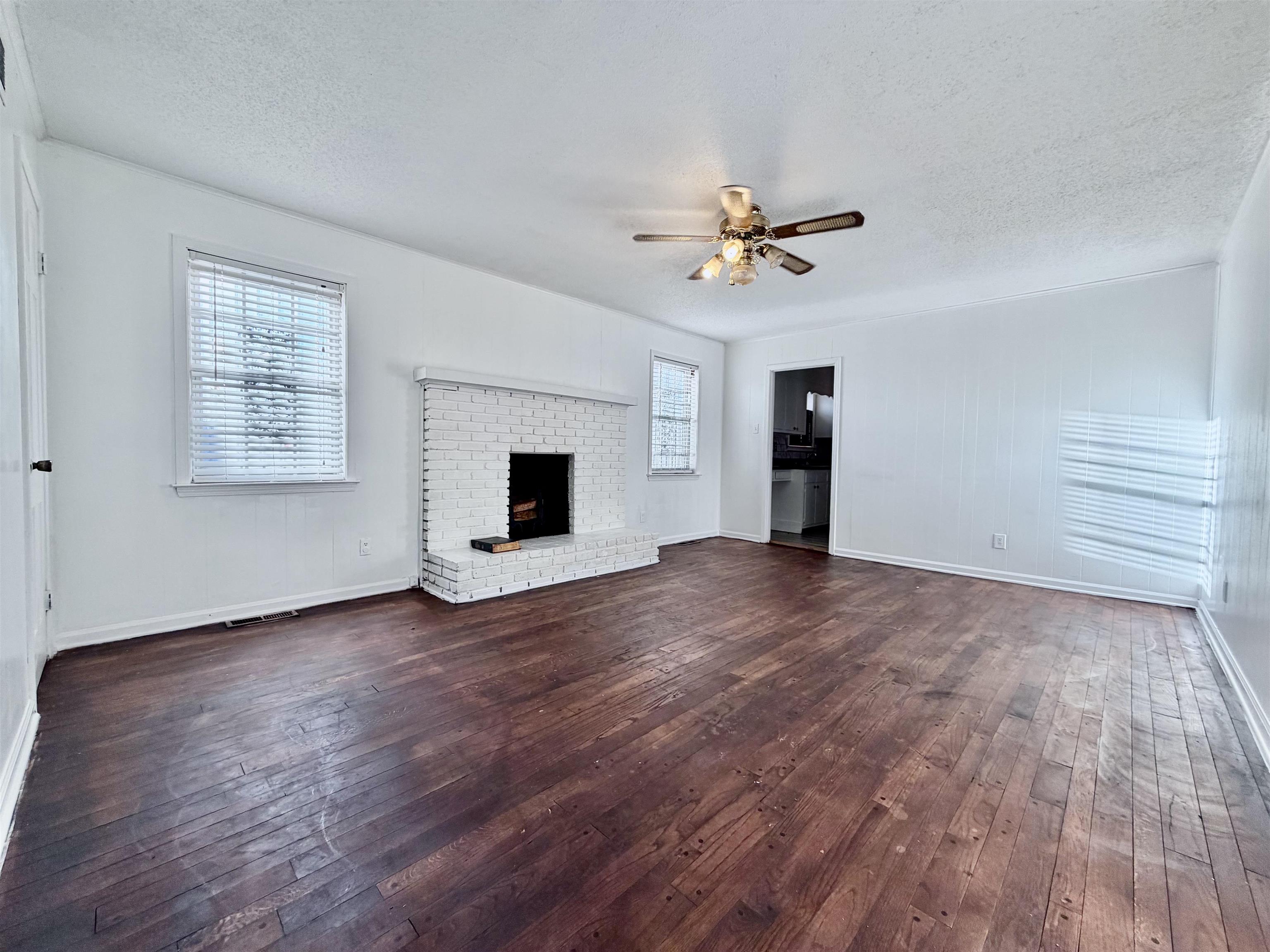 3179 Coleman Road Memphis, TN 38128 - Photo 6 of 22 a view of empty room with wooden floor and ceiling fan