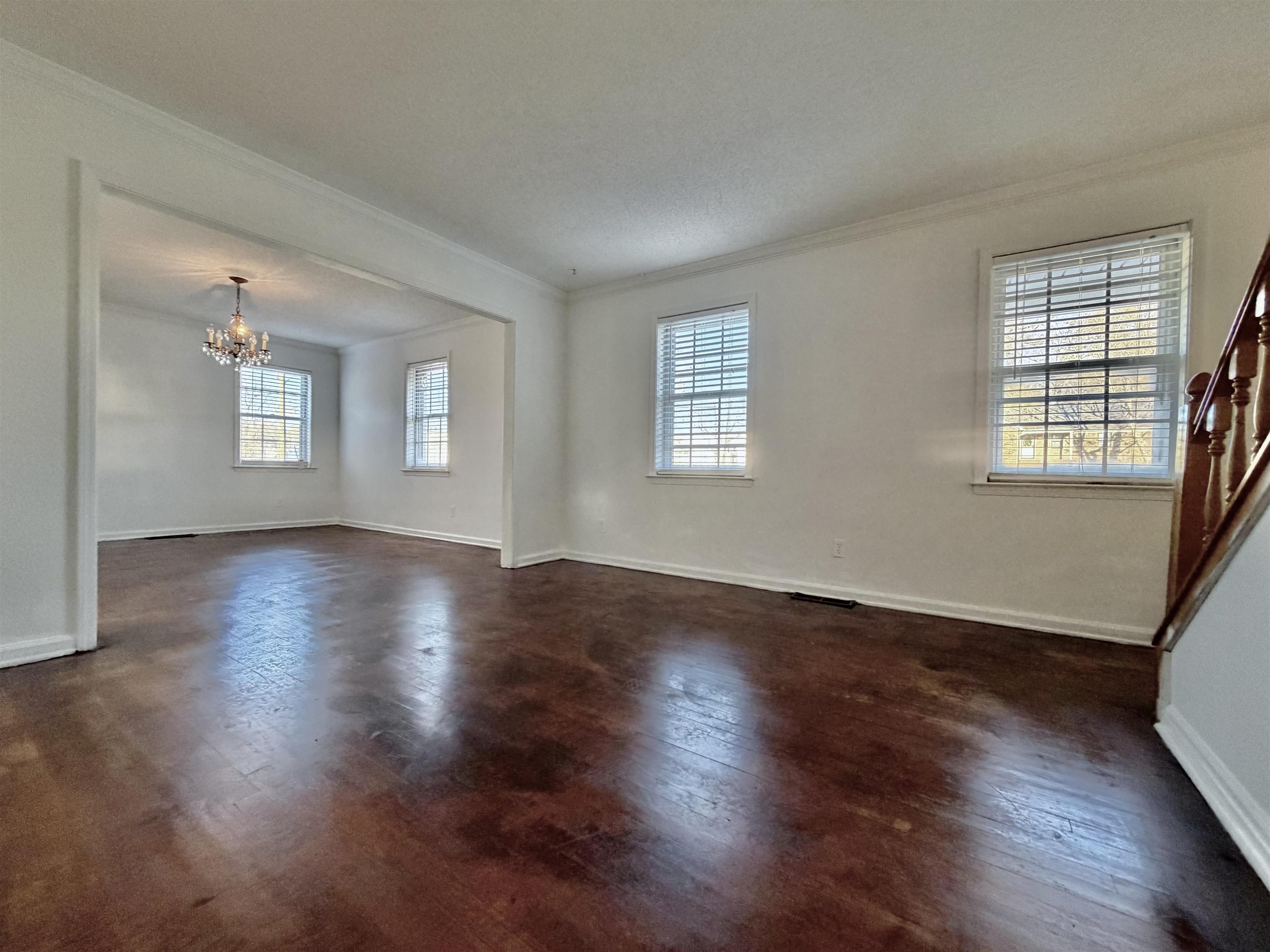 3179 Coleman Road Memphis, TN 38128 - Photo 9 of 22 a view of an empty room with wooden floor and windows