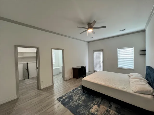 a bedroom with a bed and a tv