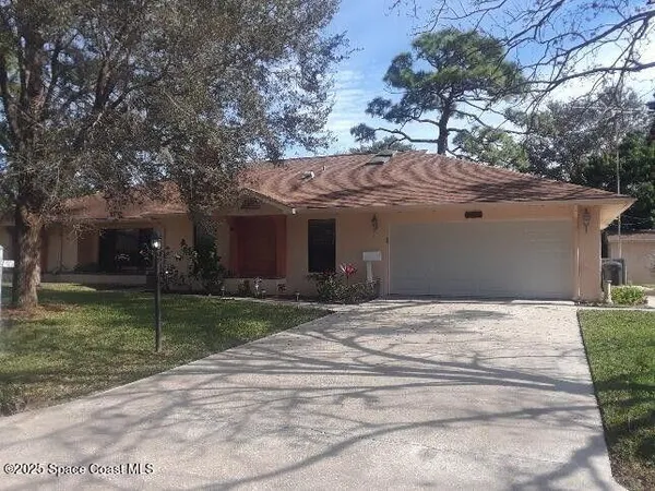 a house with trees in front of it