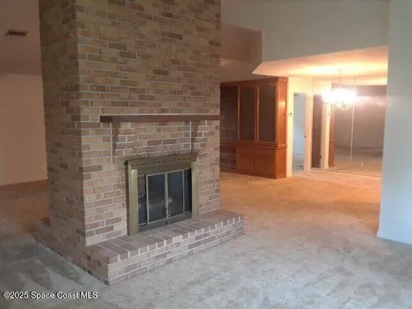 a view of a hallway with an empty room