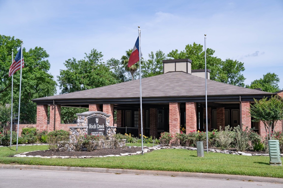 200 Hollow Tree Lane, Unit 17062 Houston, TX 77090 - Photo 9 of 16 a front view of a house with garden