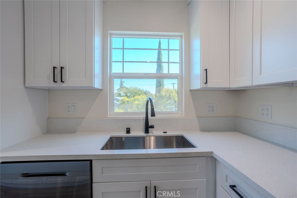 345 West 3rd Street, Unit A San Dimas, CA 91773 - Photo 4 of 12 a kitchen with appliances cabinets and a sink