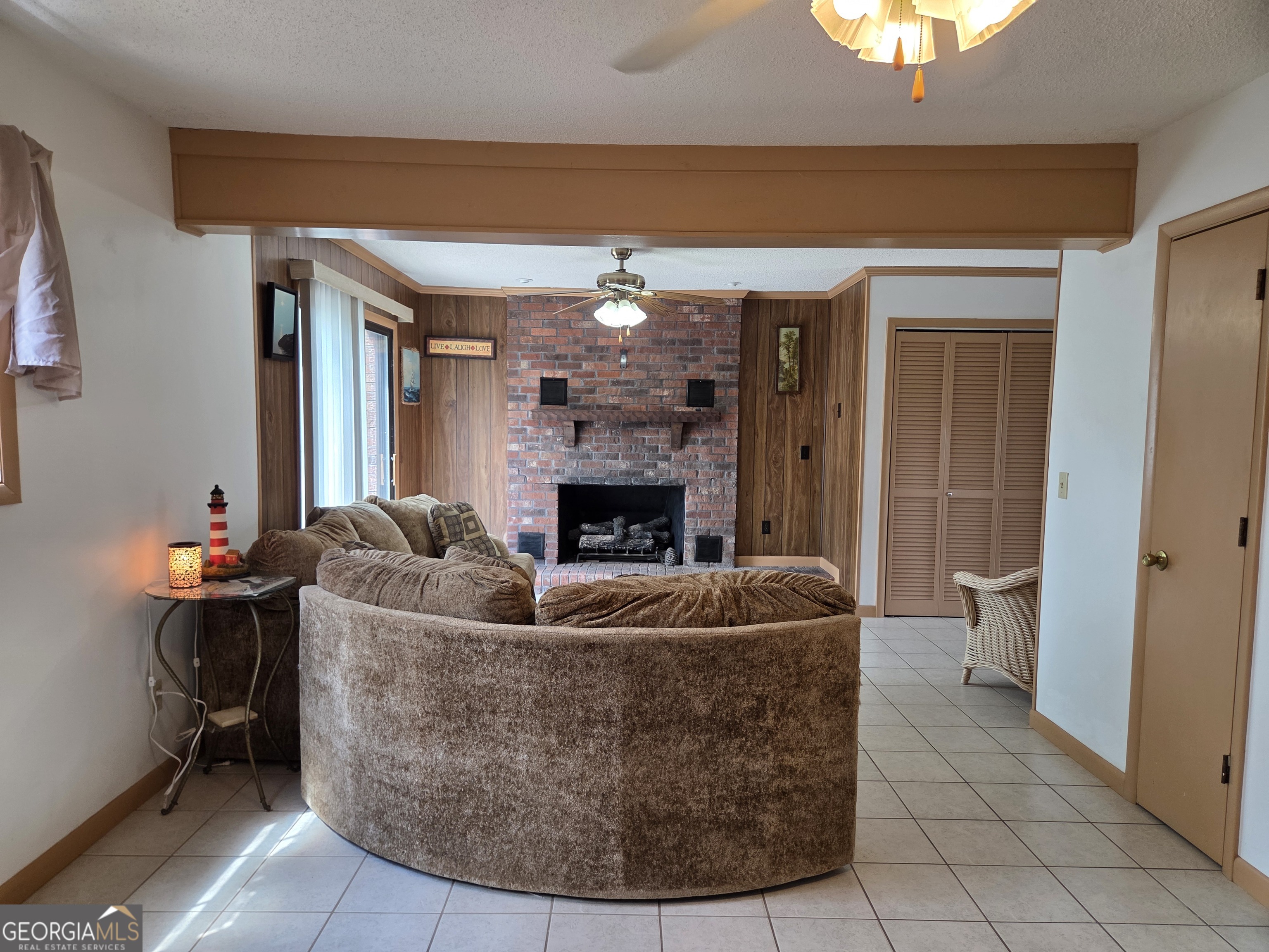 674 McNatt Falls Road Uvalda, GA 30473 - Photo 17 of 58 a living room with furniture and a fireplace