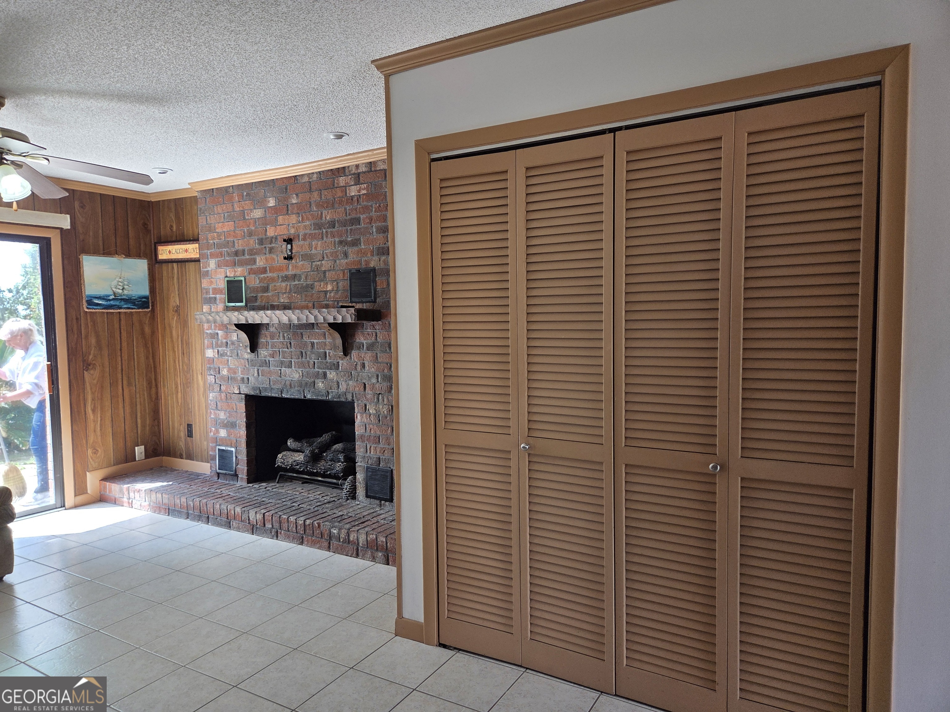 674 McNatt Falls Road Uvalda, GA 30473 - Photo 18 of 58 a view of an empty room with a fireplace and a window