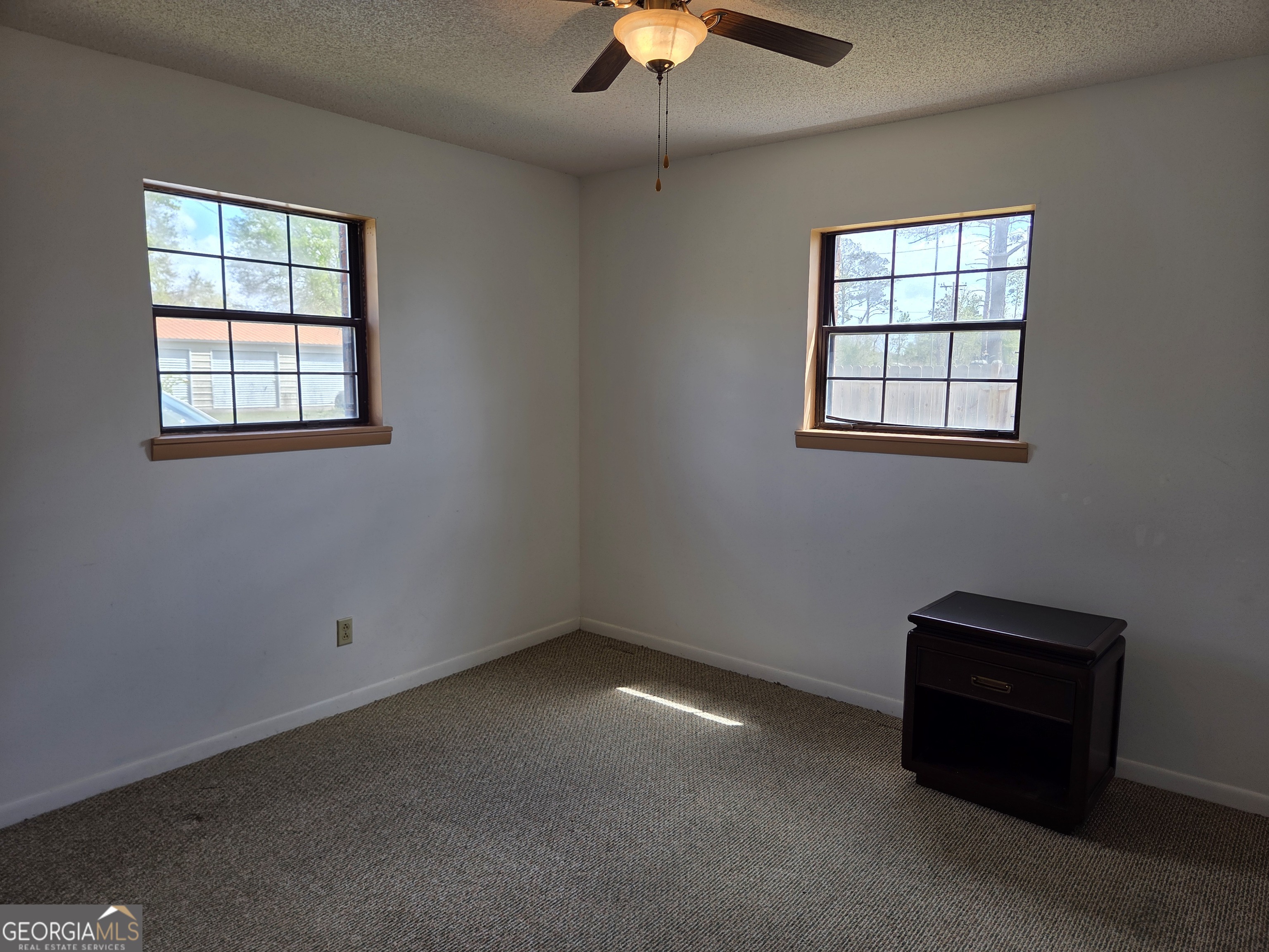 674 McNatt Falls Road Uvalda, GA 30473 - Photo 20 of 58 an empty room with a window