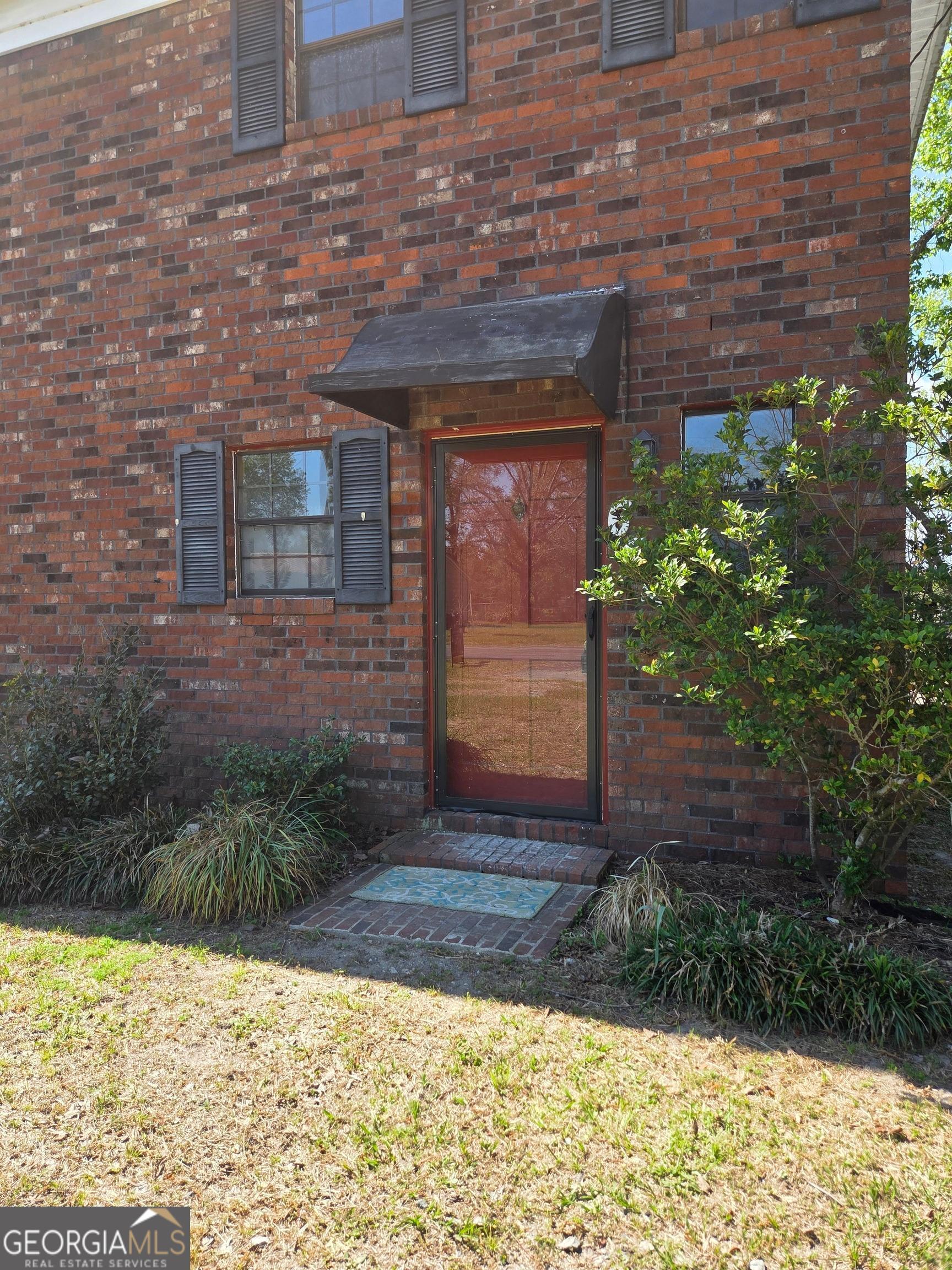 674 McNatt Falls Road Uvalda, GA 30473 - Photo 2 of 58 a front view of a house with a yard