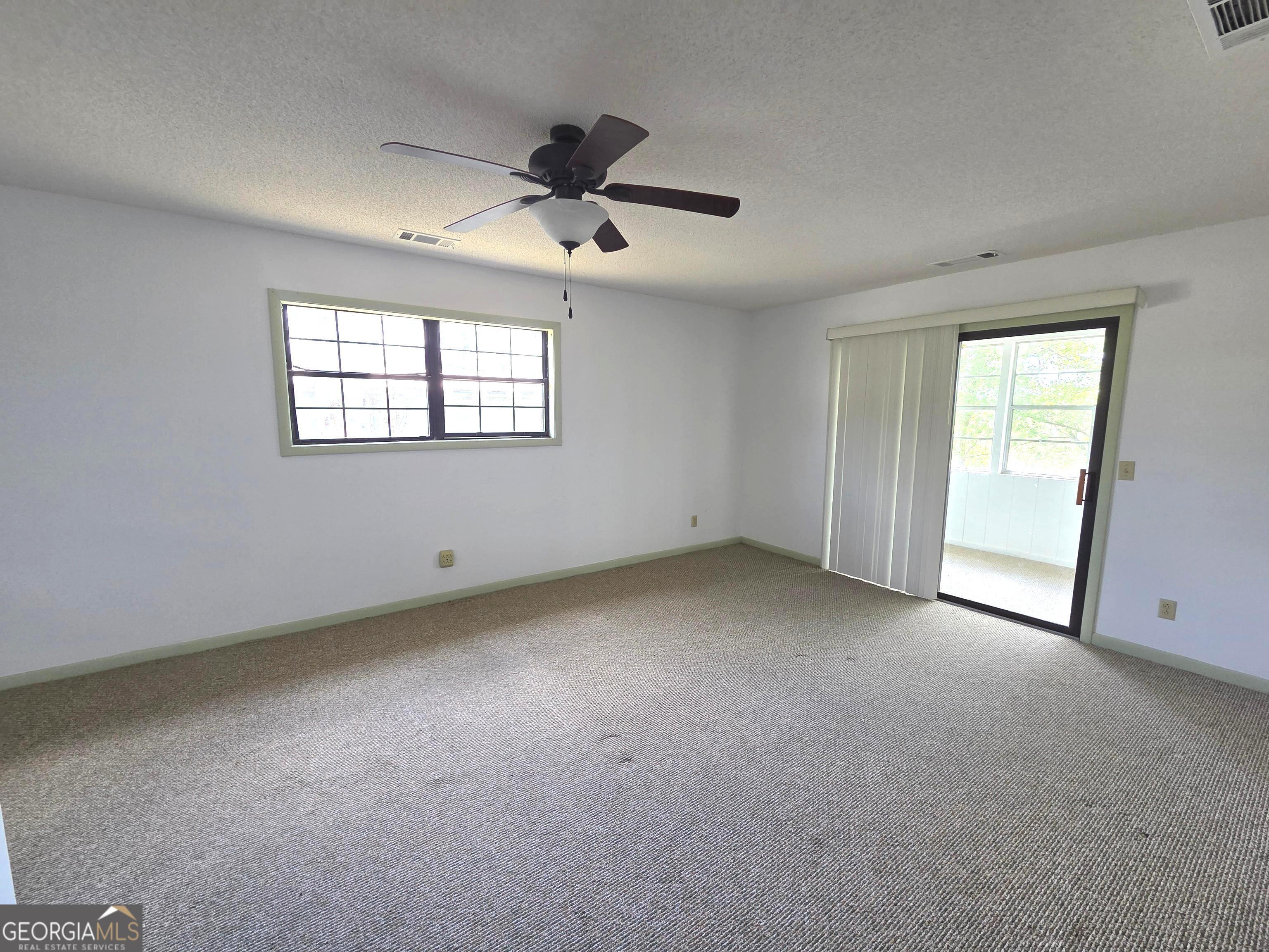 674 McNatt Falls Road Uvalda, GA 30473 - Photo 30 of 58 a view of an empty room with a window