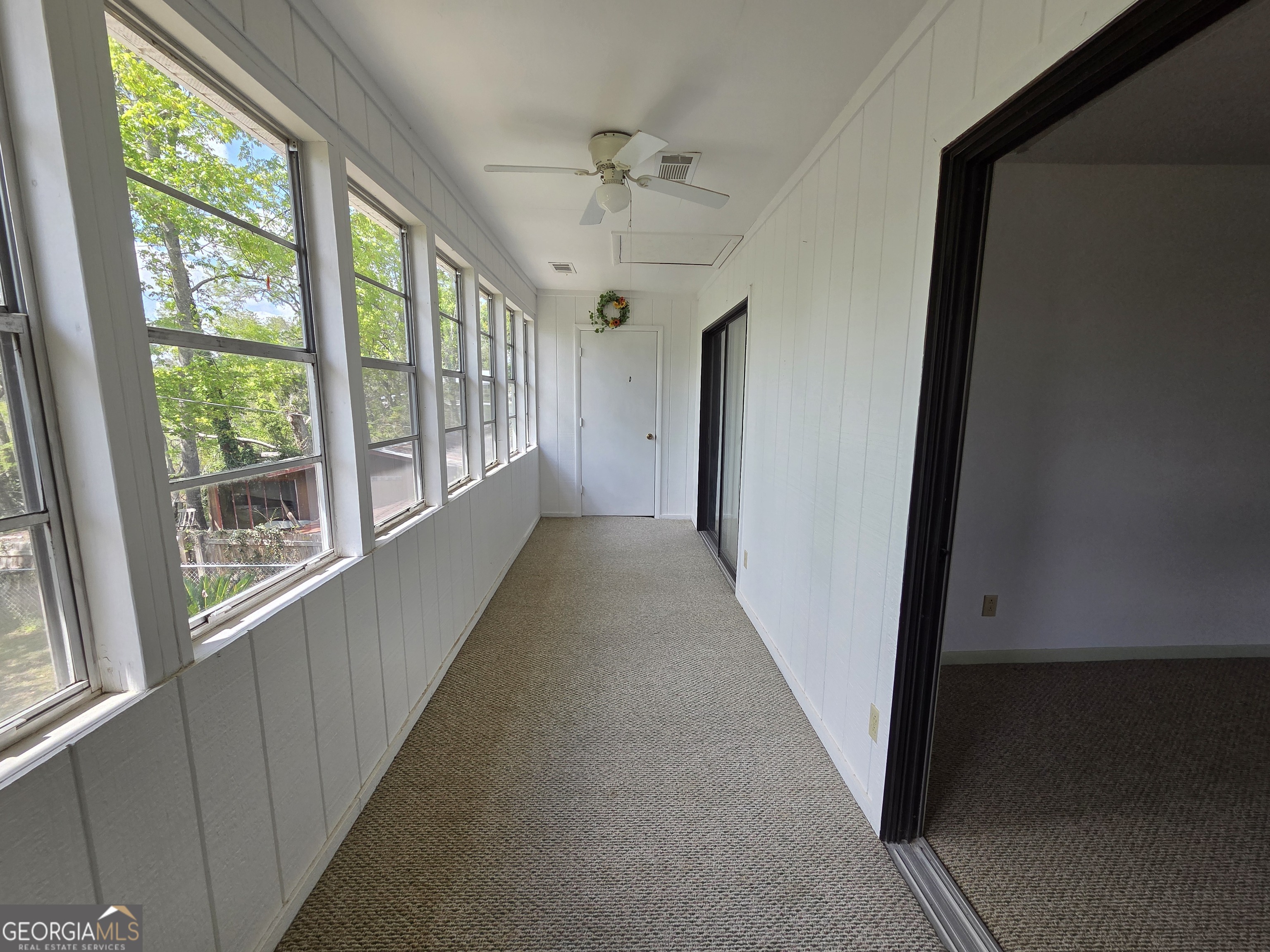 674 McNatt Falls Road Uvalda, GA 30473 - Photo 34 of 58 a view of a hallway with a ceiling fan and windows