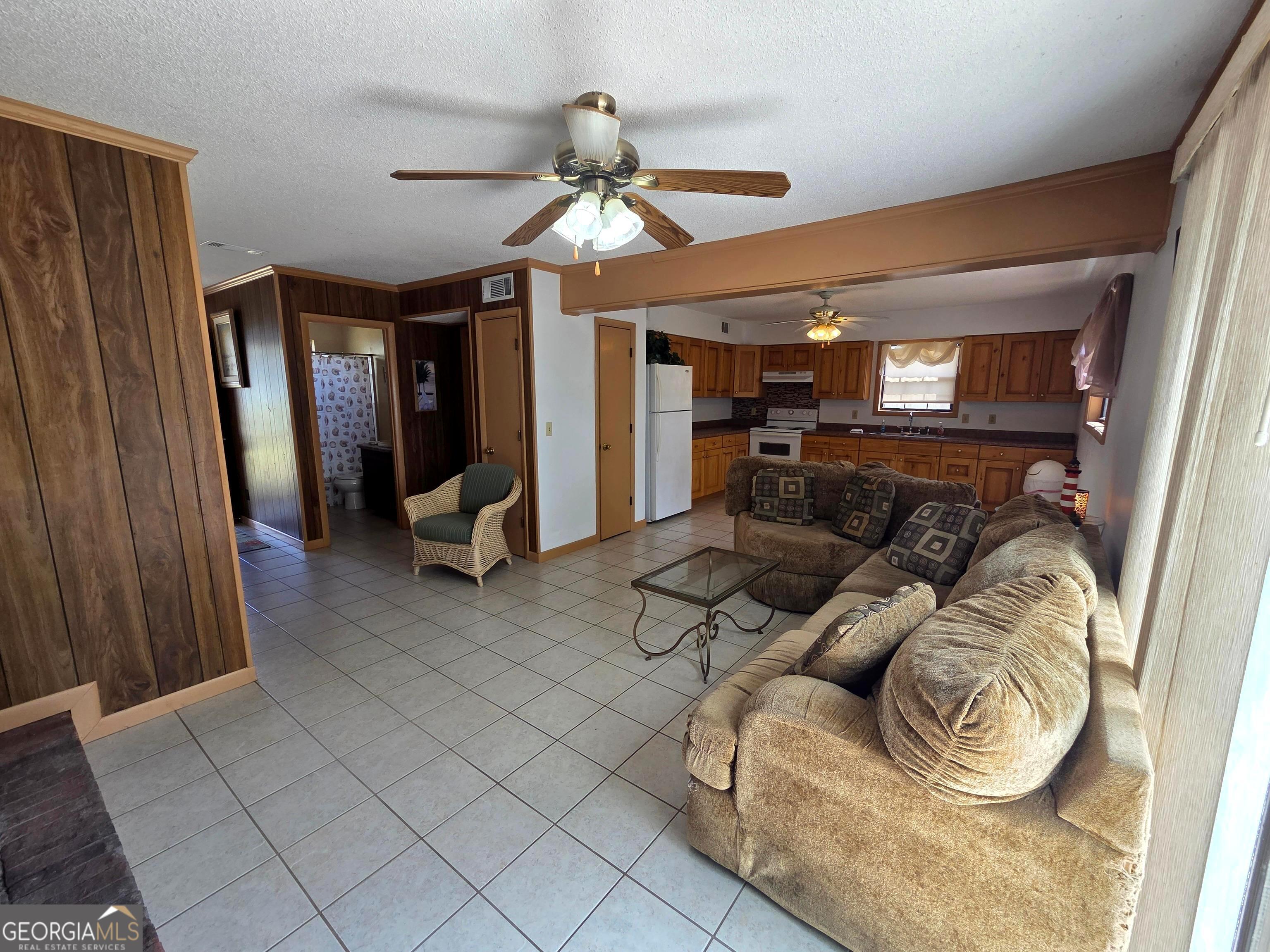 674 McNatt Falls Road Uvalda, GA 30473 - Photo 40 of 58 a living room with furniture and a flat screen tv