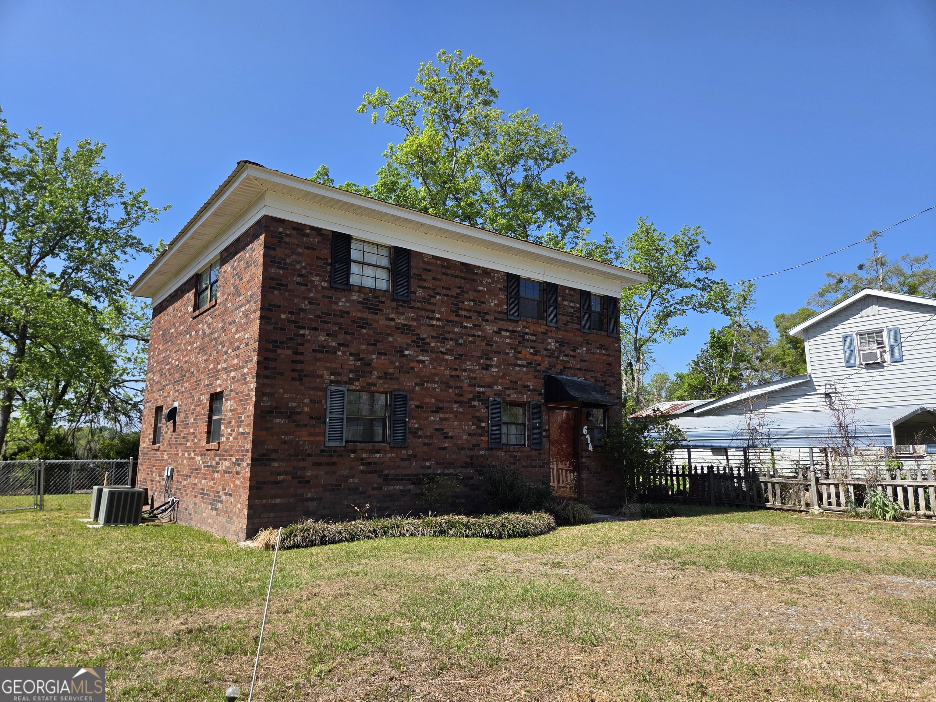 674 McNatt Falls Road Uvalda, GA 30473 - Photo 4 of 58 a front view of a house with a yard