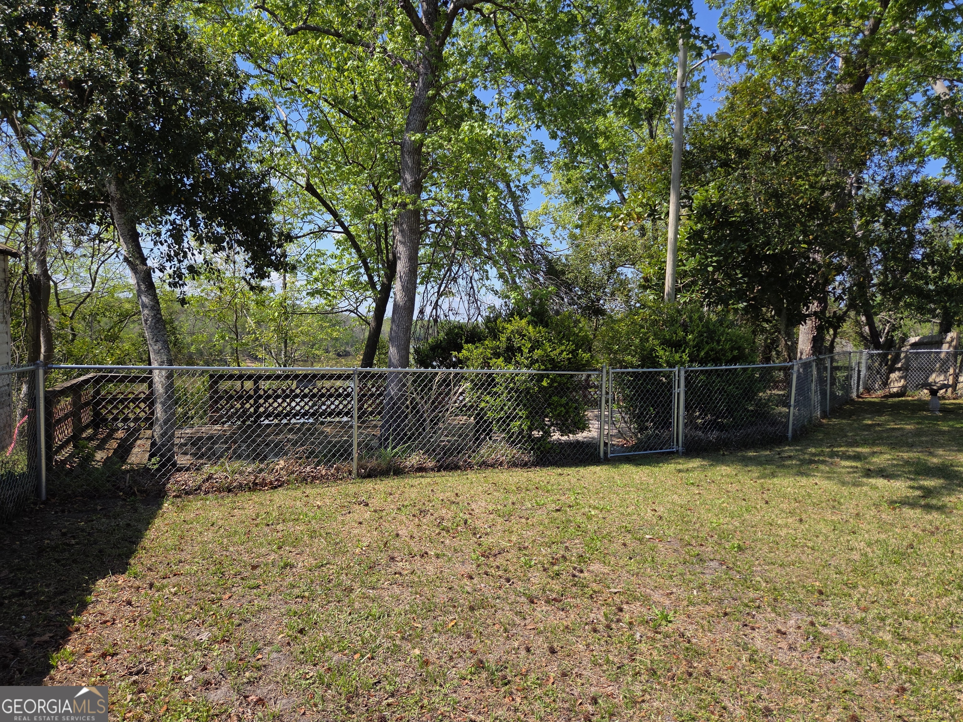 674 McNatt Falls Road Uvalda, GA 30473 - Photo 45 of 58 a view of a yard with wooden fence