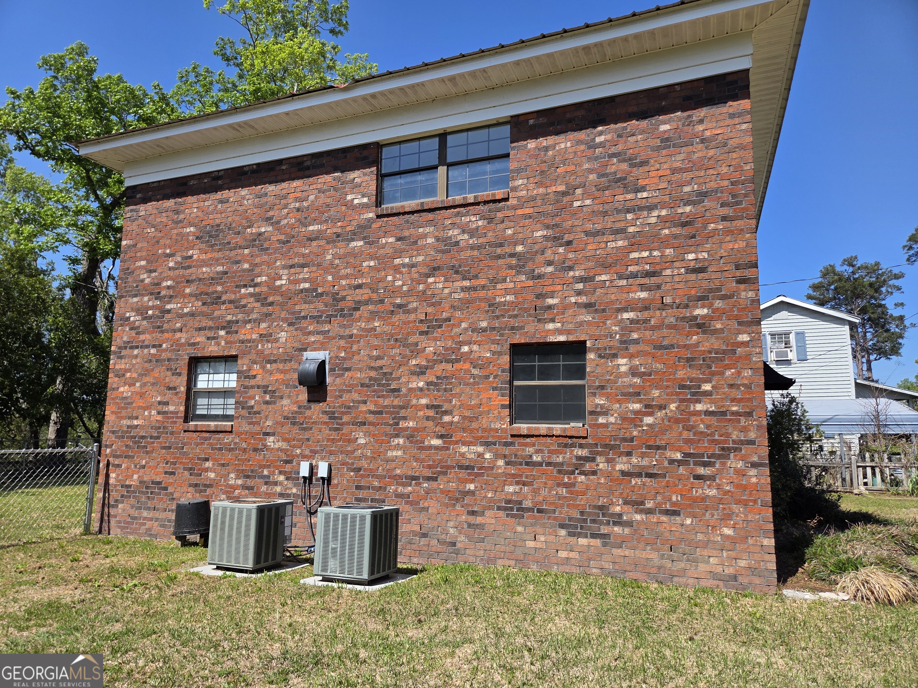 674 McNatt Falls Road Uvalda, GA 30473 - Photo 56 of 58 a brick building with a door in front of it