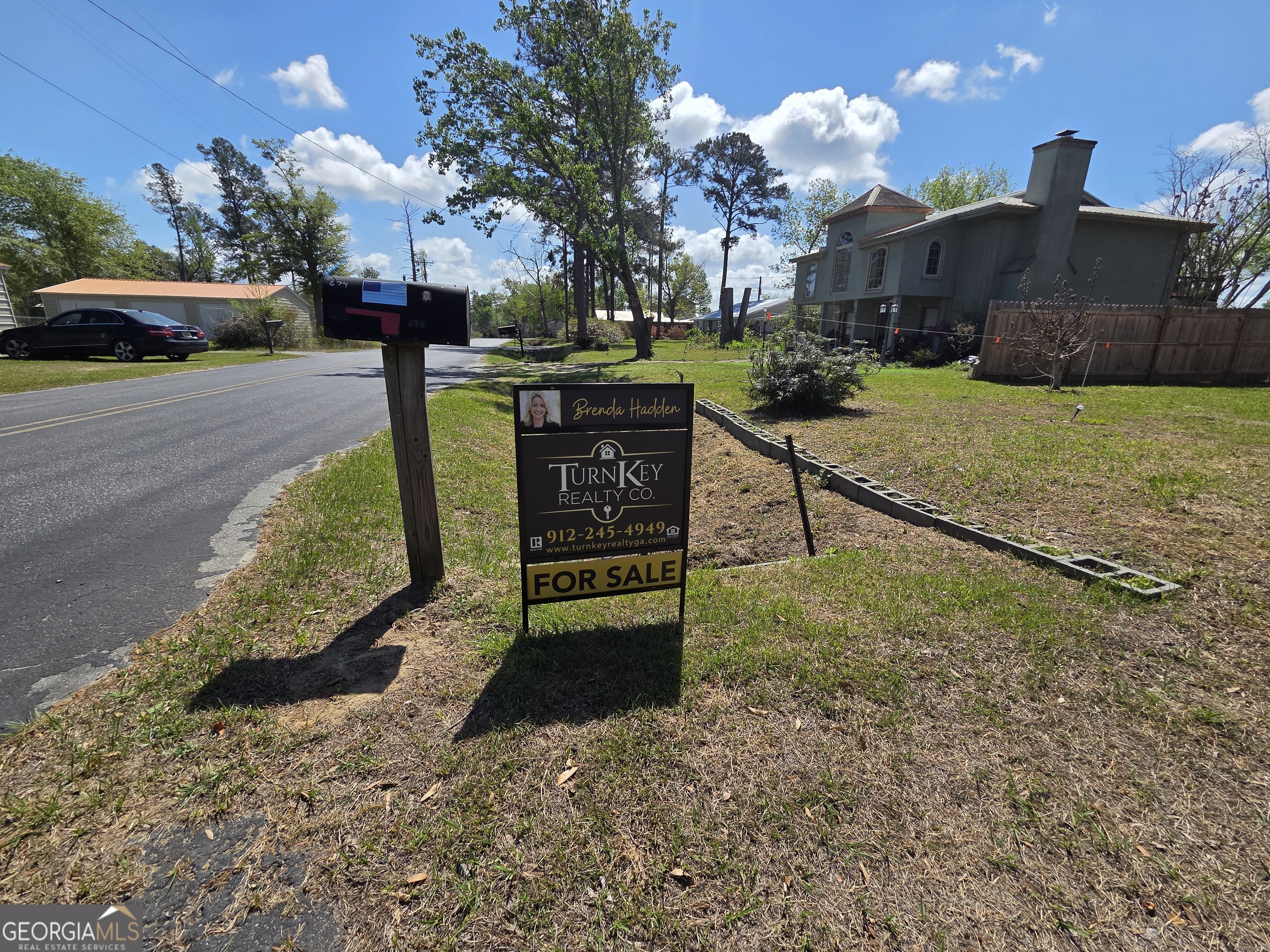 674 McNatt Falls Road Uvalda, GA 30473 - Photo 58 of 58 a view of a street with a building and a street sign