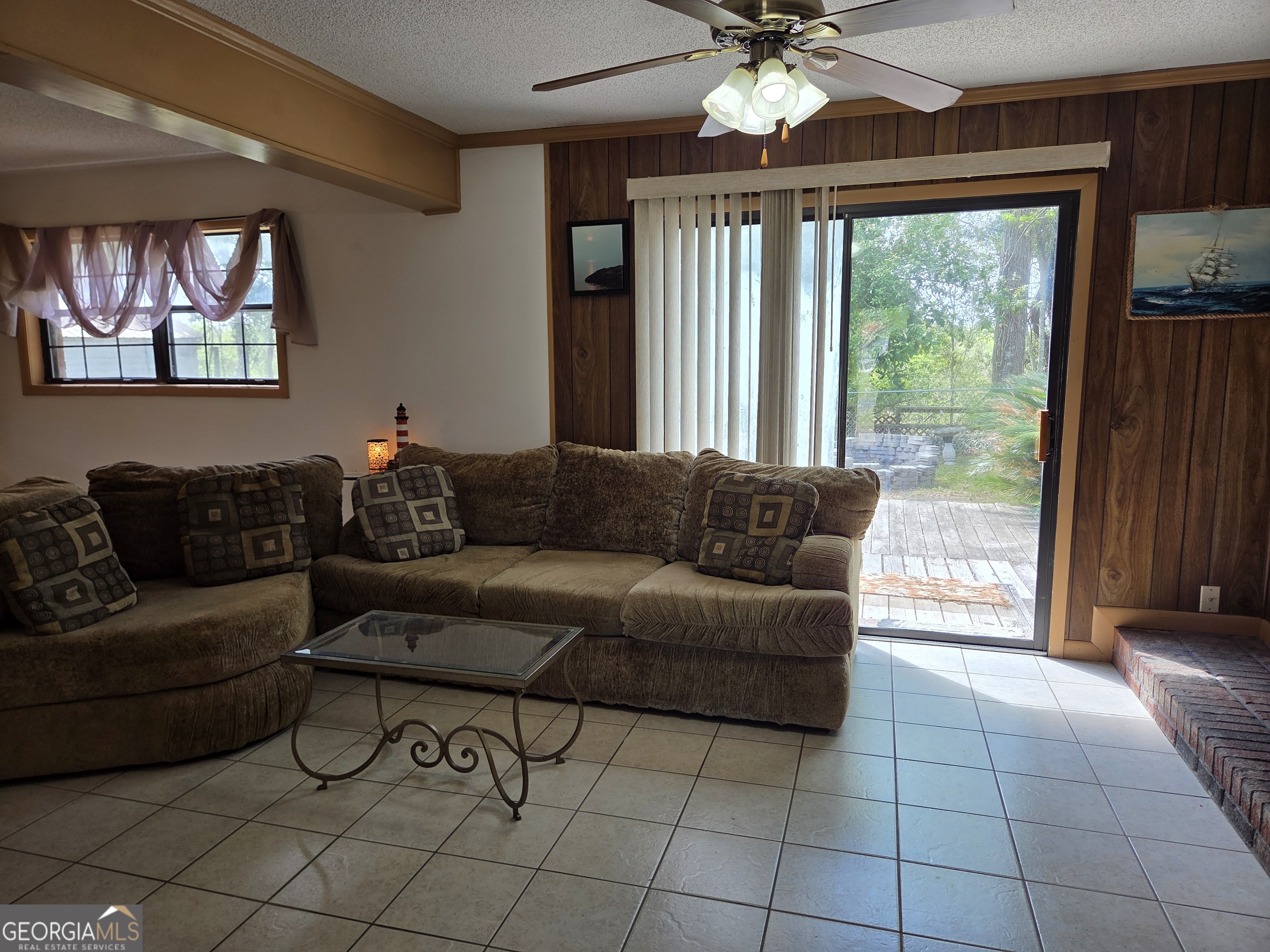 674 McNatt Falls Road Uvalda, GA 30473 - Photo 9 of 58 a living room with furniture and a large window