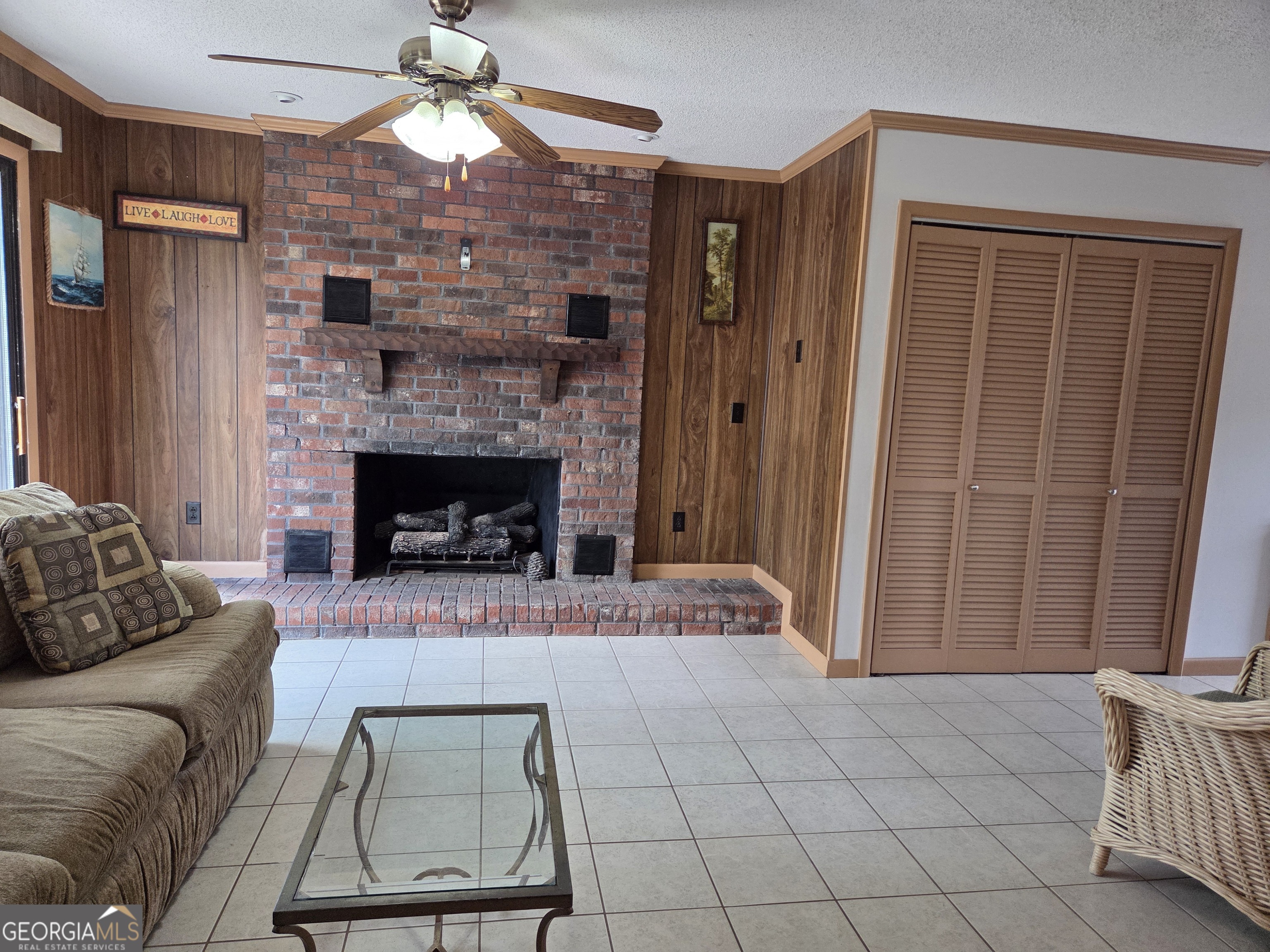 674 McNatt Falls Road Uvalda, GA 30473 - Photo 10 of 58 a living room with furniture and a fireplace