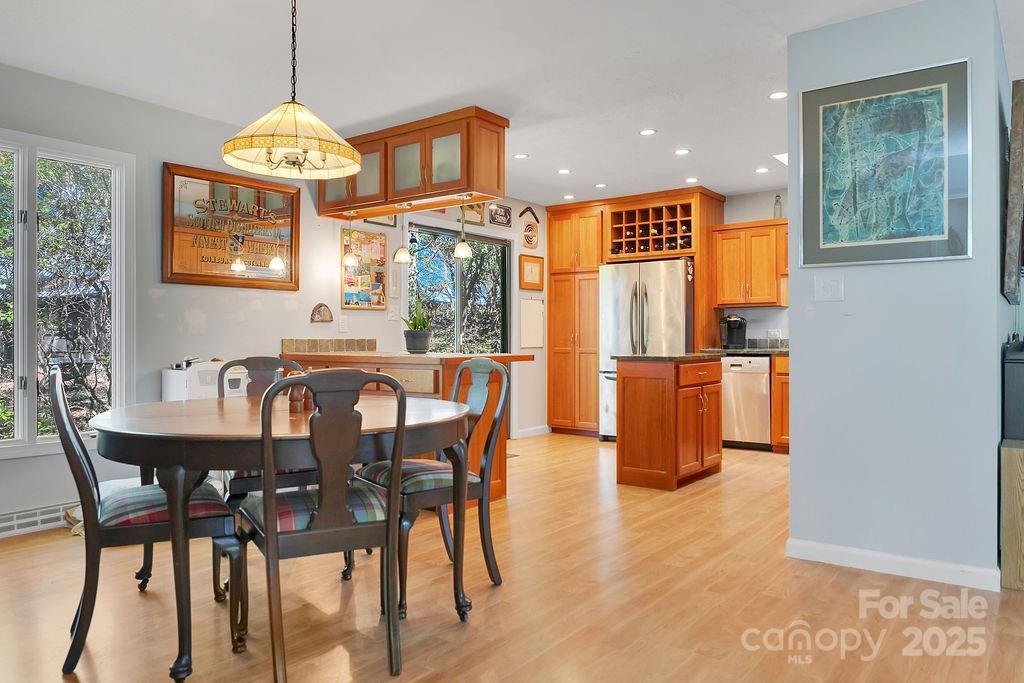 109 Rocky Hill Overlook Road Brevard, NC 28712 - Photo 14 of 41 a view of a dining room with furniture window and wooden floor