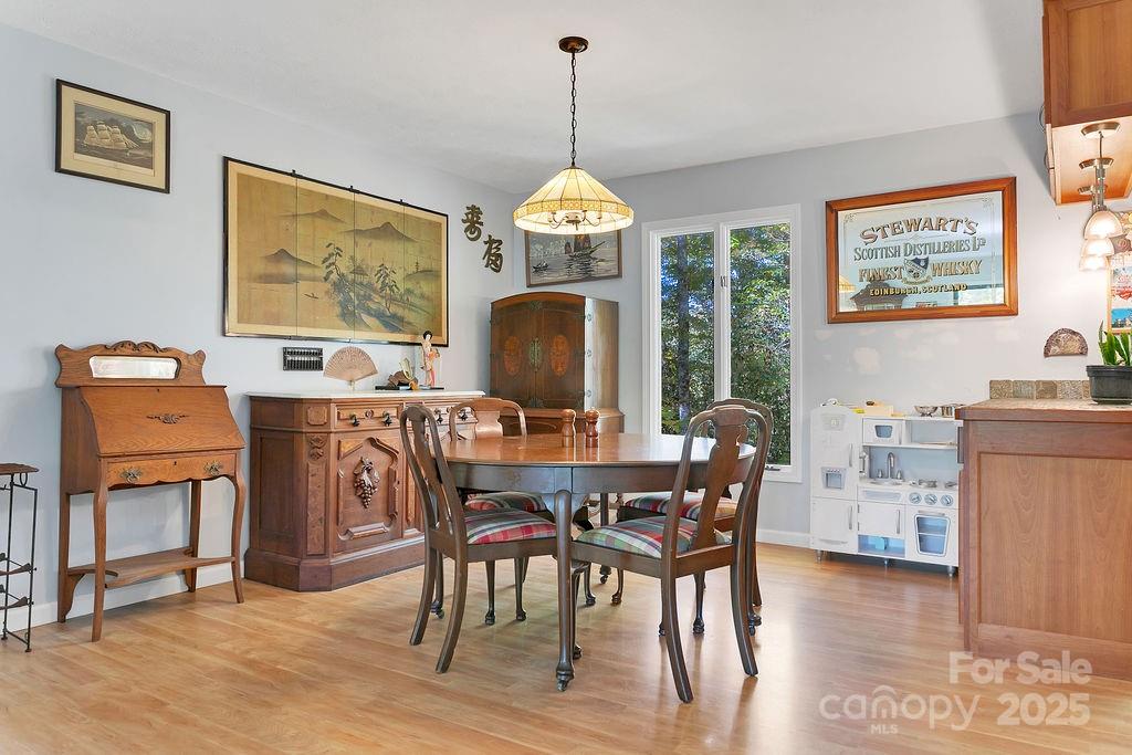 109 Rocky Hill Overlook Road Brevard, NC 28712 - Photo 15 of 41 a dining room with furniture window wooden floor