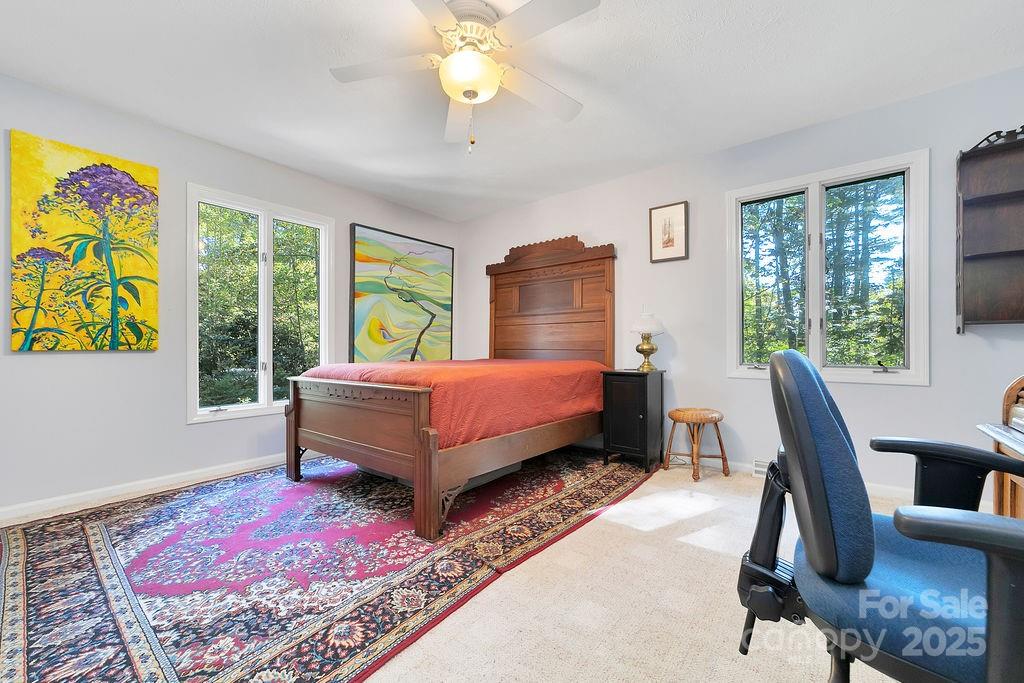 109 Rocky Hill Overlook Road Brevard, NC 28712 - Photo 27 of 41 a bedroom with a bed next to a window