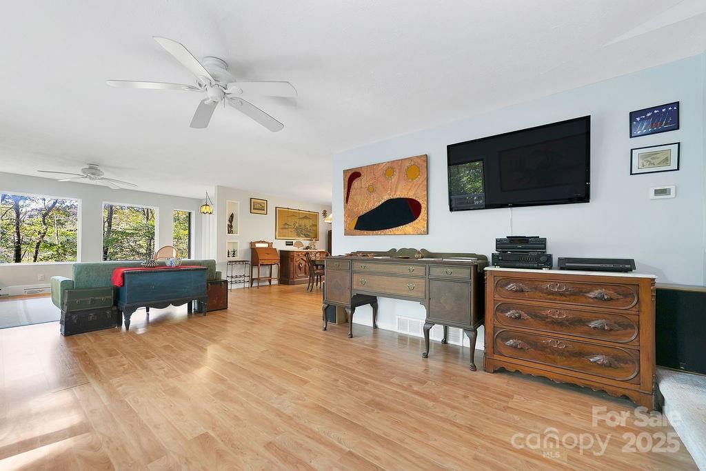 109 Rocky Hill Overlook Road Brevard, NC 28712 - Photo 9 of 41 a living room with furniture and a flat screen tv