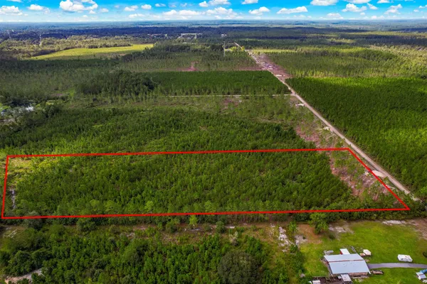 a view of a lake with a floor to ceiling window