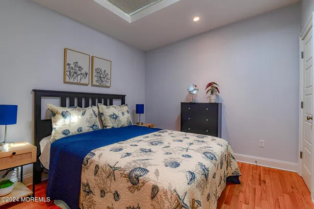 a bed sitting in a bedroom and a table