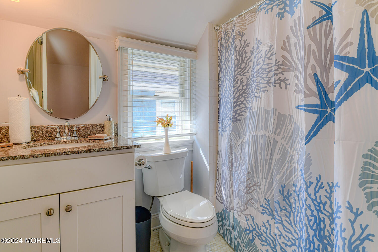 94 Clark Avenue Ocean Grove, NJ 07756 - Photo 21 of 29 a bathroom with a granite countertop toilet sink and mirror
