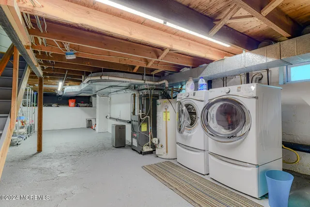 a view of storage and utility room with washer and dryer