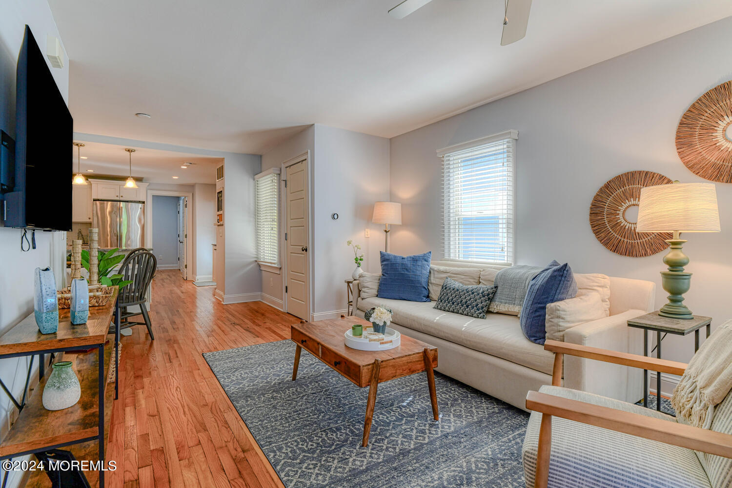 94 Clark Avenue Ocean Grove, NJ 07756 - Photo 7 of 29 a living room with furniture a flat screen tv and a large window