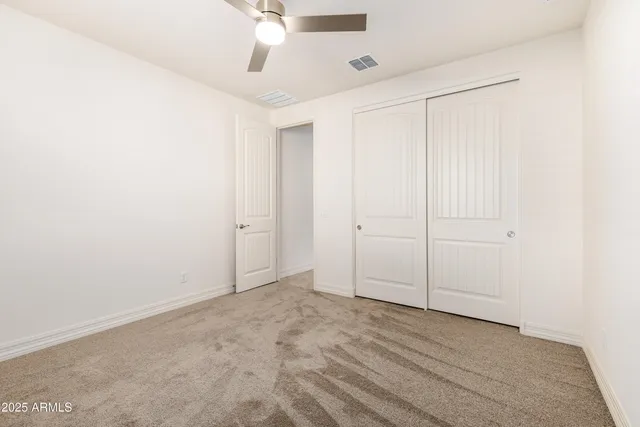 an empty room with fan